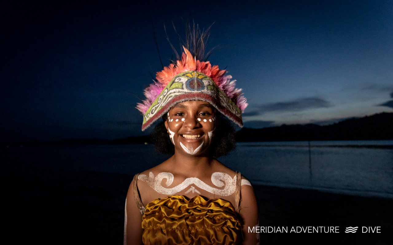 Papuan girl smiling in traditional dress