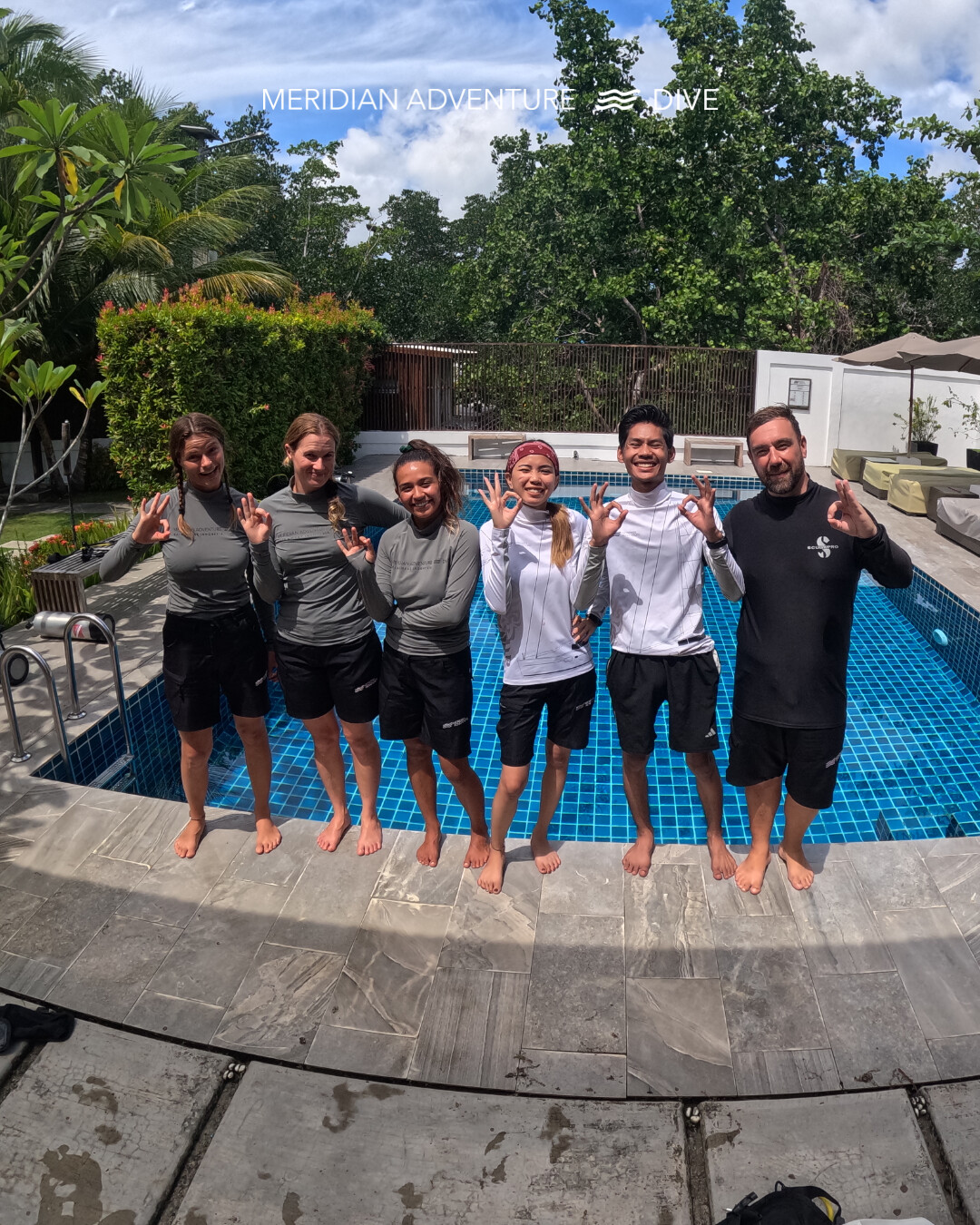 Meridian Adventure Dive Raja Ampat IDC group photo — PADI instructor candidates and team at the resort