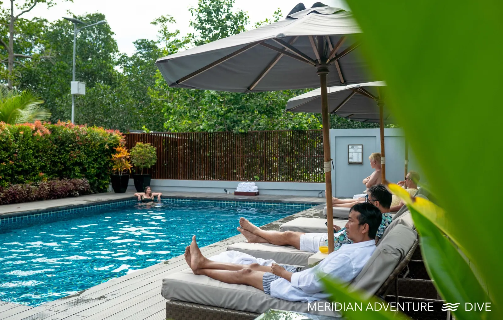 Comfortable poolside atmosphere at a land-based dive resort in Raja Ampat