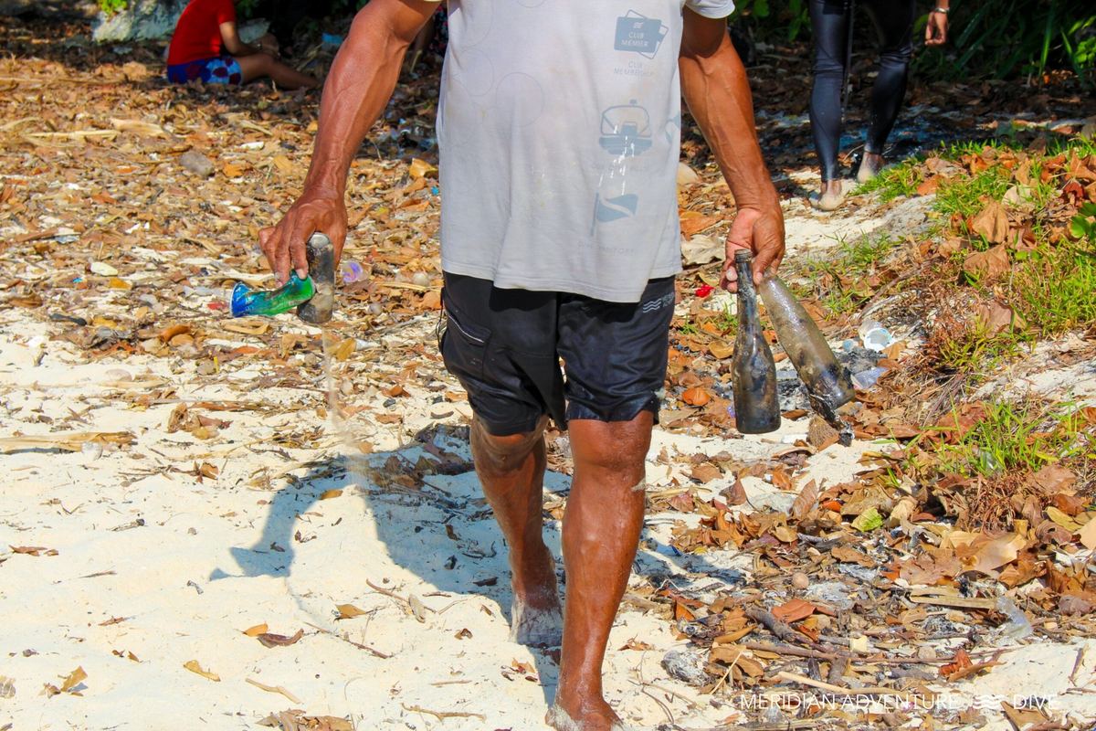 Community waste sorting after a beach clean-up in Raja Ampat