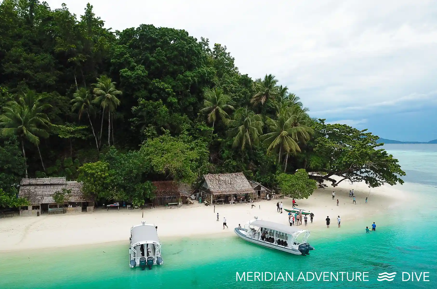 Meridian Adventure dive boats at a remote island in Raja Ampat