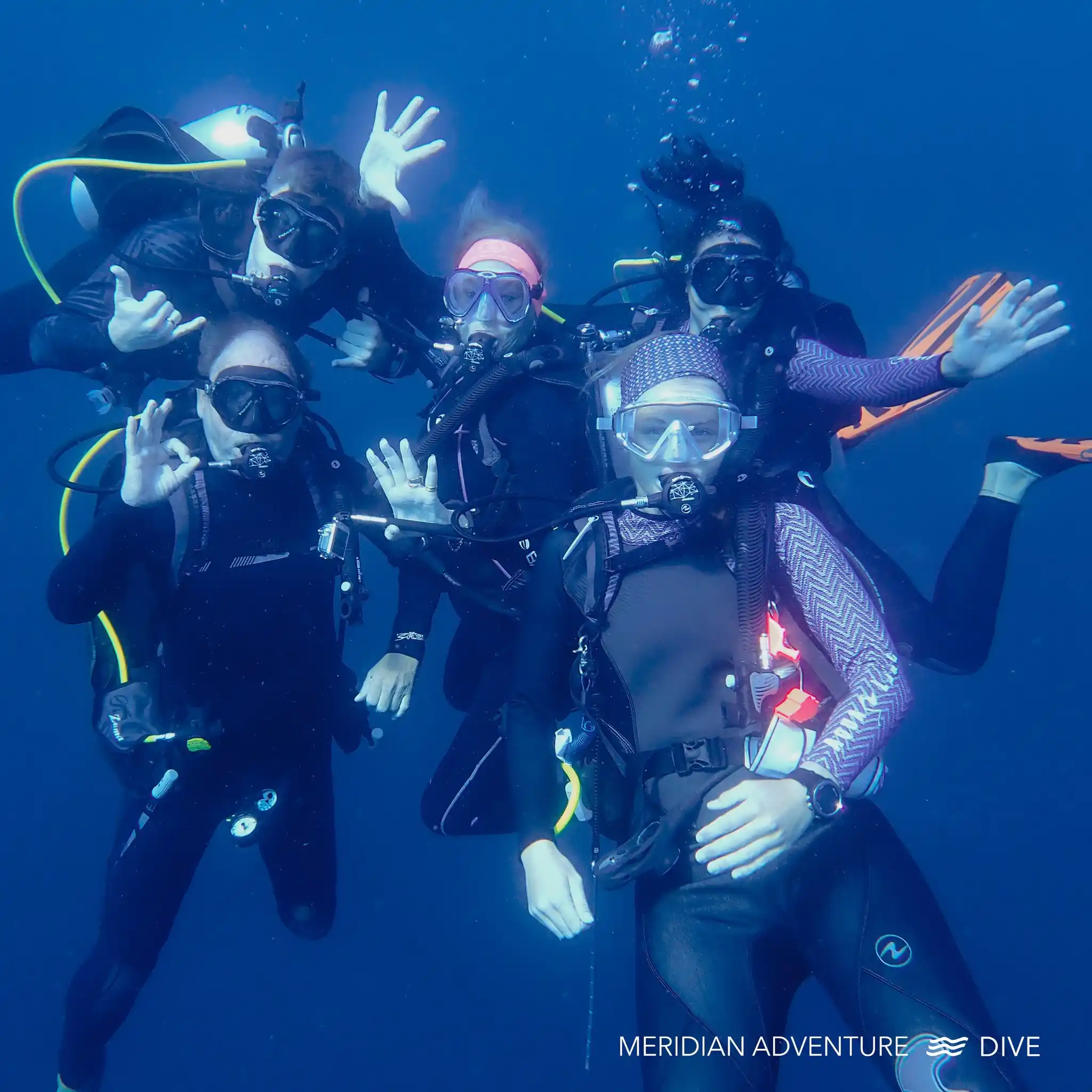 Scuba diving buddy team planning a safe and enjoyable dive